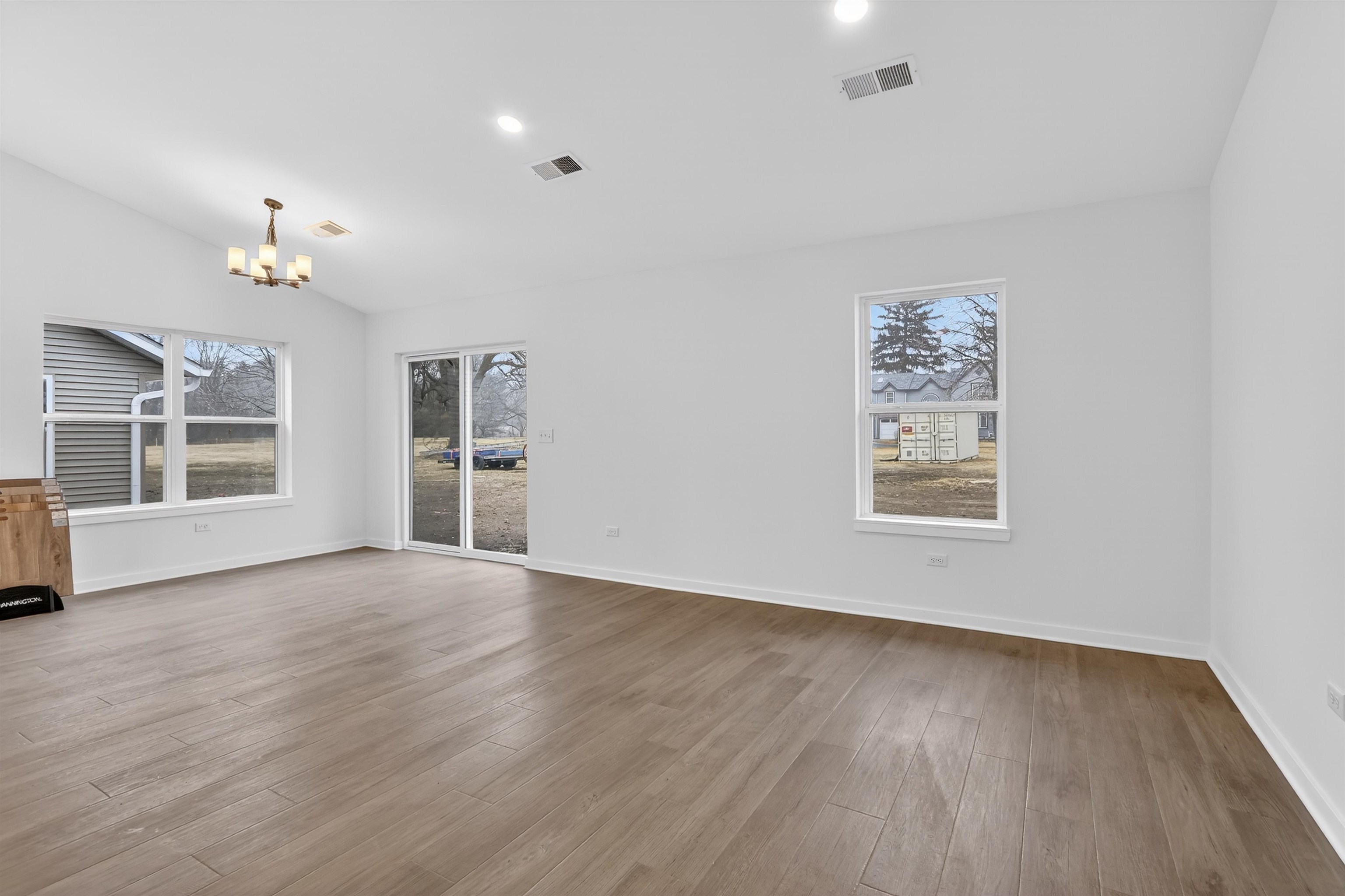 307 West South Street Durand, IL 61024 - Photo 10 of 27 wooden floor in an empty room with a window