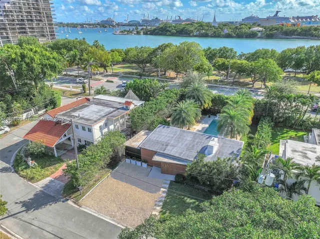 an aerial view of a house with a lake view