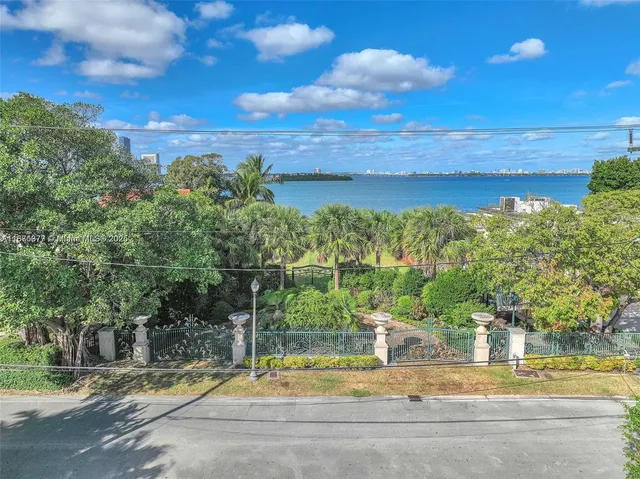 a view of a swimming pool with an outdoor space and seating area