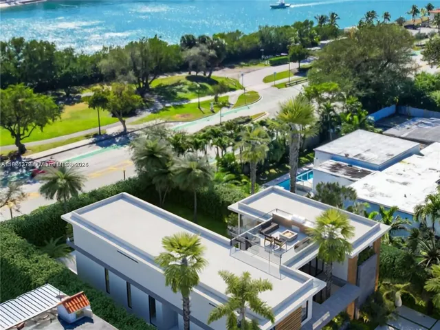 an aerial view of a house with outdoor space