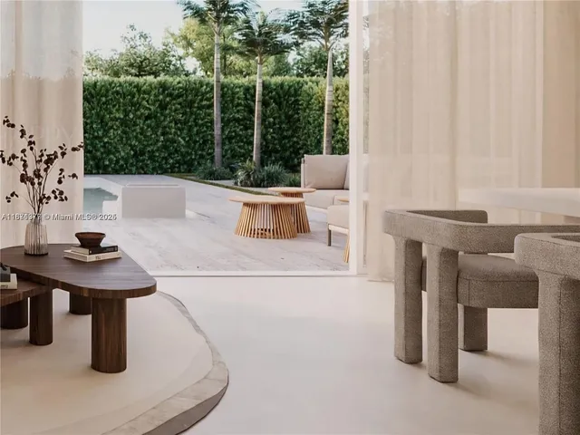 a view of a room with a table and chairs