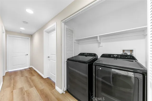 a kitchen with a stove and a refrigerator