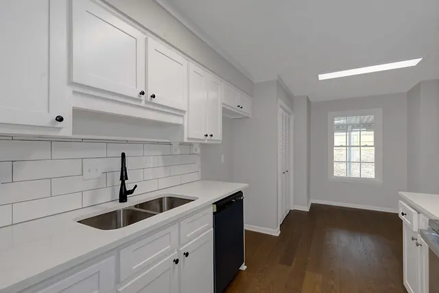 a kitchen with a sink and cabinets