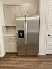 a refrigerator freezer sitting inside of a kitchen