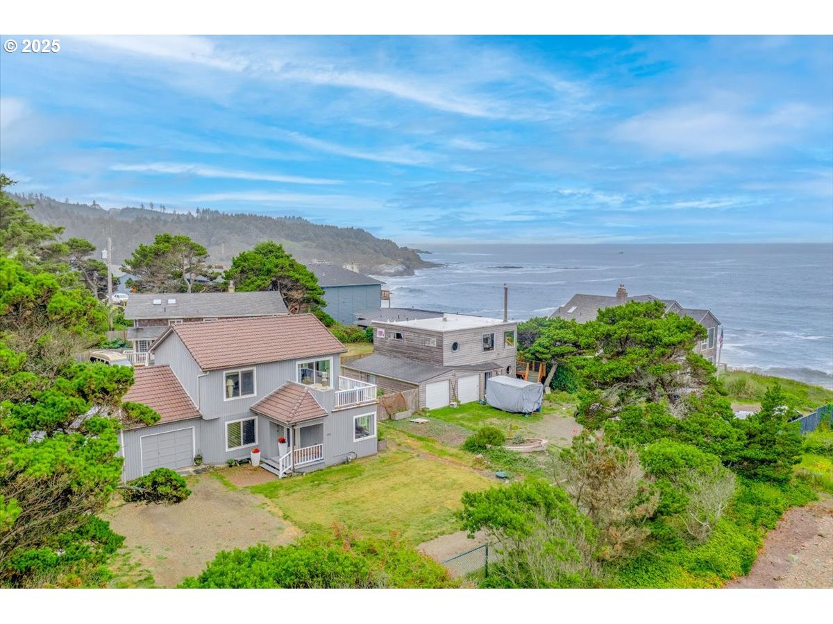 60 Raven Lane Depoe Bay, OR 97341 - Photo 2 of 43 a view of a house with a yard