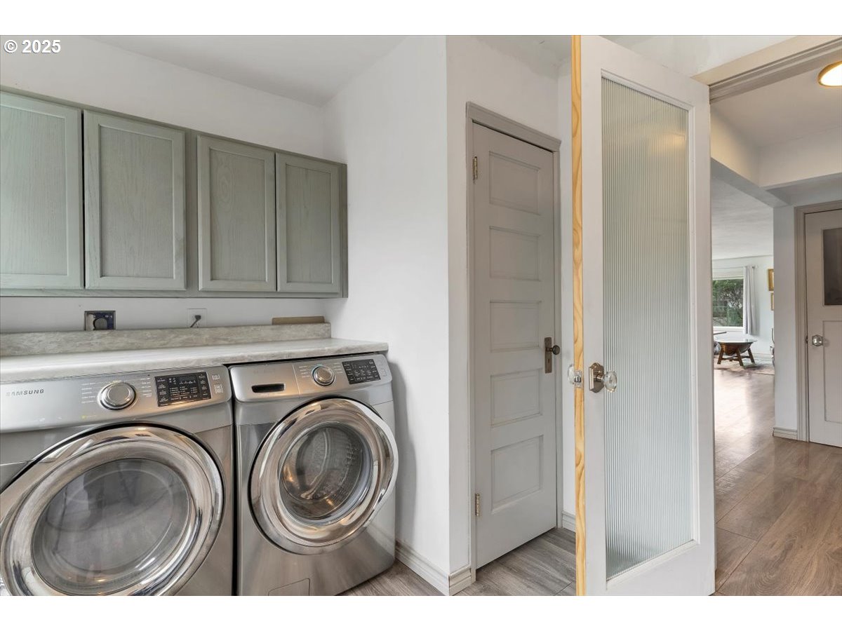 60 Raven Lane Depoe Bay, OR 97341 - Photo 21 of 43 a view of a kitchen with washer and dryer