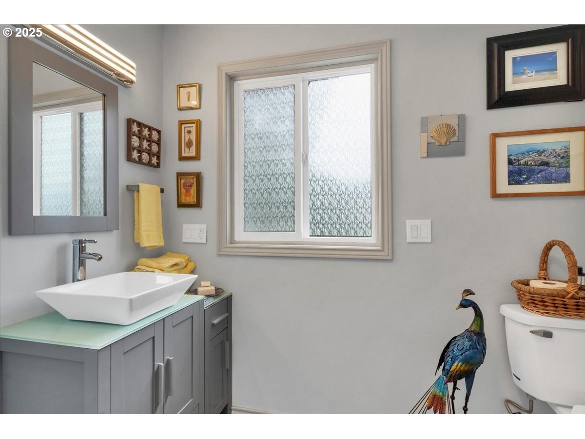 60 Raven Lane Depoe Bay, OR 97341 - Photo 22 of 43 a bathroom with a sink and a mirror