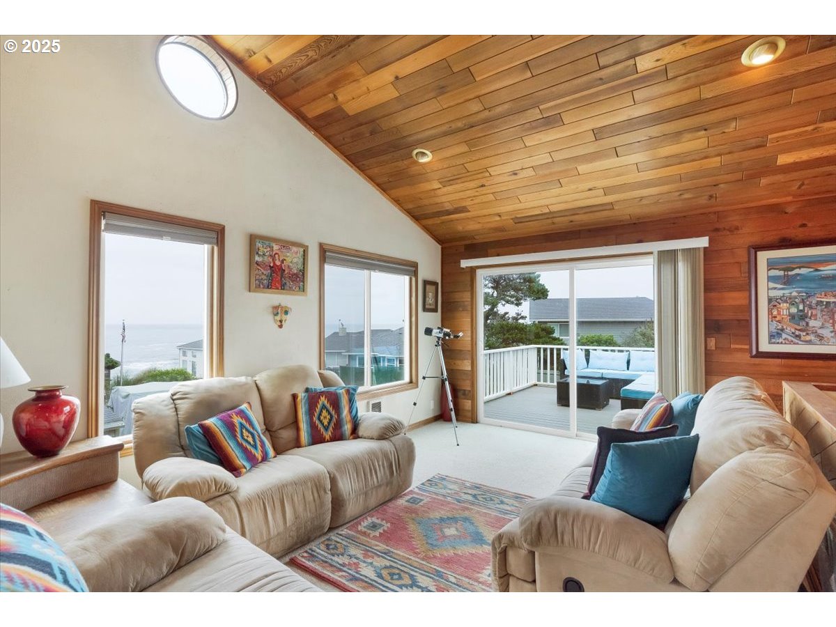 60 Raven Lane Depoe Bay, OR 97341 - Photo 27 of 43 a living room with furniture and a large window