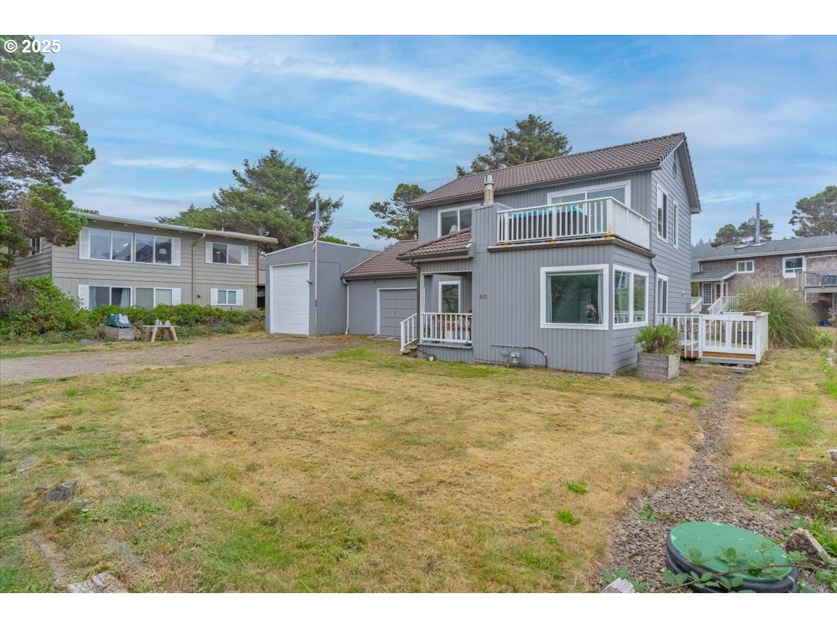 60 Raven Lane Depoe Bay, OR 97341 - Photo 40 of 43 a house view with a garden space