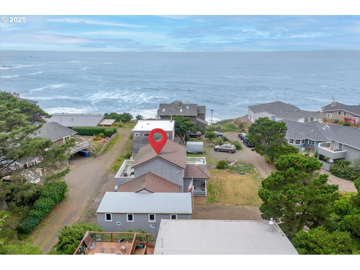 60 Raven Lane Depoe Bay, OR 97341 - Photo 4 of 43 an aerial view of a house with a yard