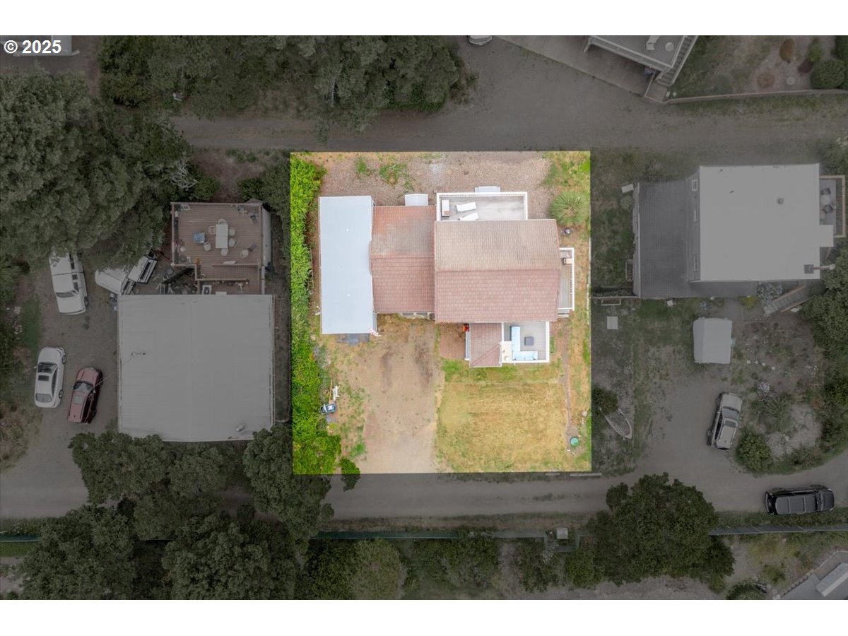 60 Raven Lane Depoe Bay, OR 97341 - Photo 43 of 43 a aerial view of a house with a yard