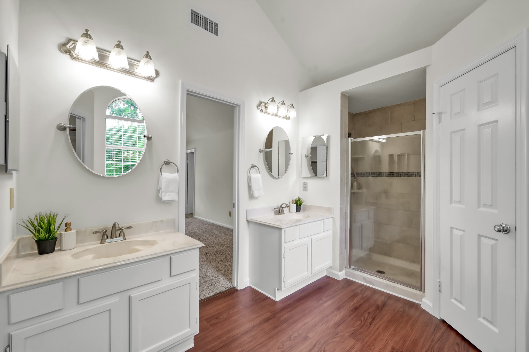 114 Regency Way Conroe, TX 77304 - Photo 28 of 48 Primary bath with separate shower and tub, dual vanities and vaulted ceiling.