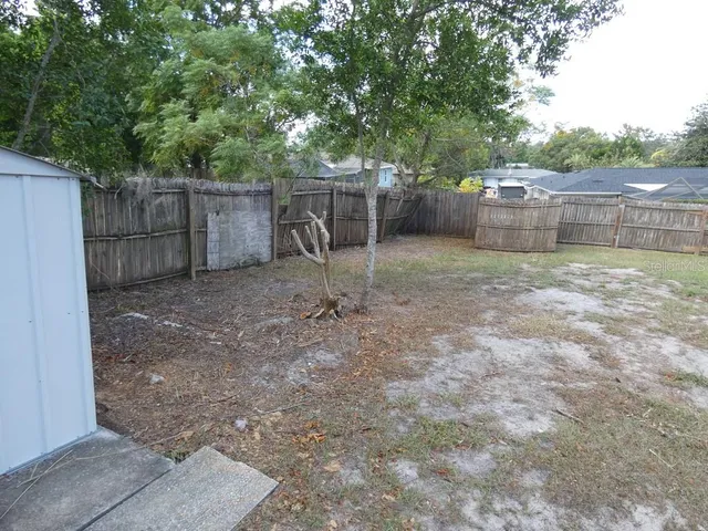 a view of backyard with green space