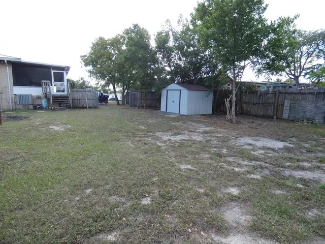 a view of backyard with green space