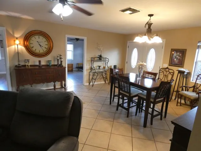 a backyard of a house with a swing and stairs