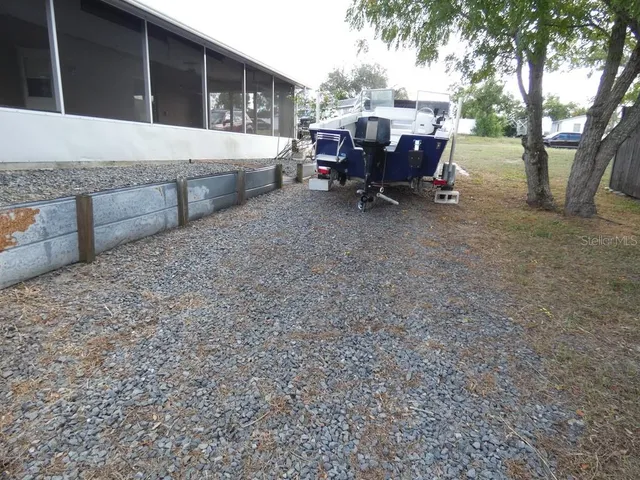 a view of a yard with tree s