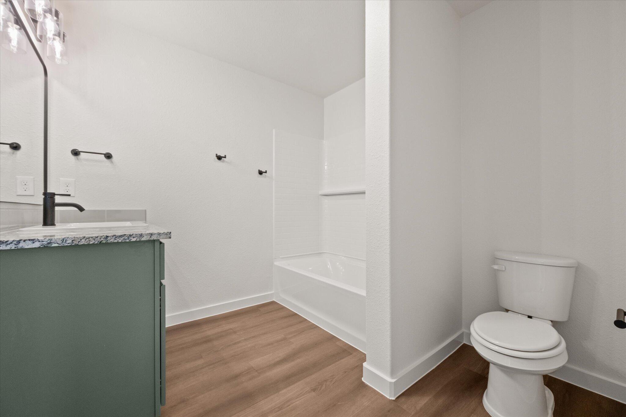 7111 14th Street Lubbock, TX 79416 - Photo 19 of 25 a bathroom with a sink and a toilet