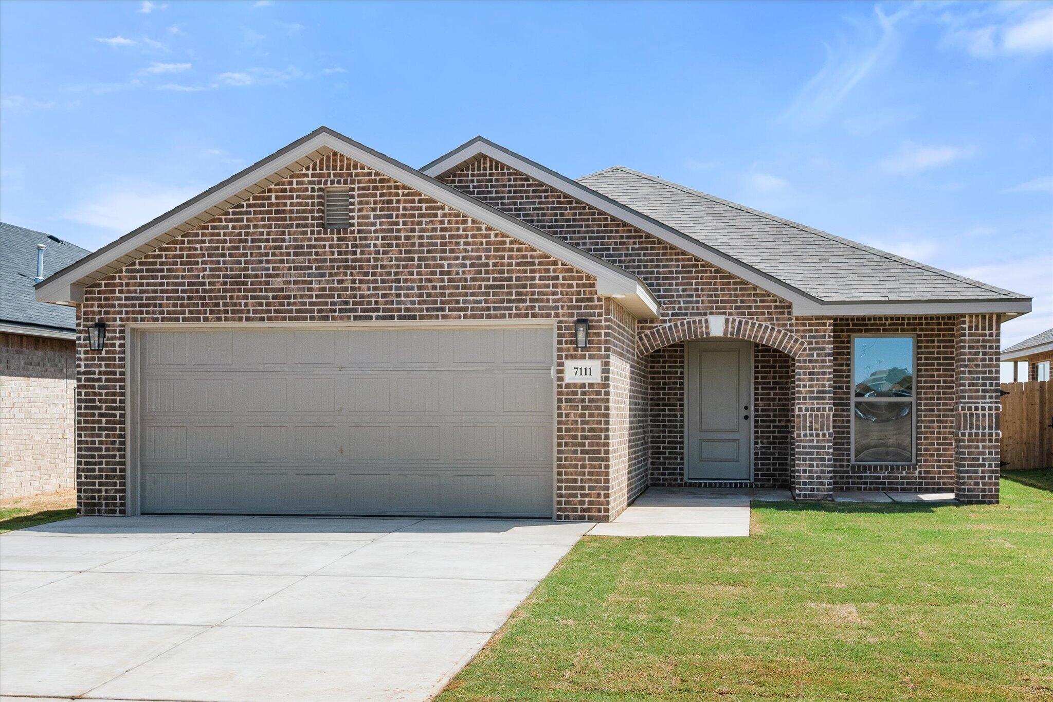 7111 14th Street Lubbock, TX 79416 - Photo 2 of 25 a view of a house with a yard