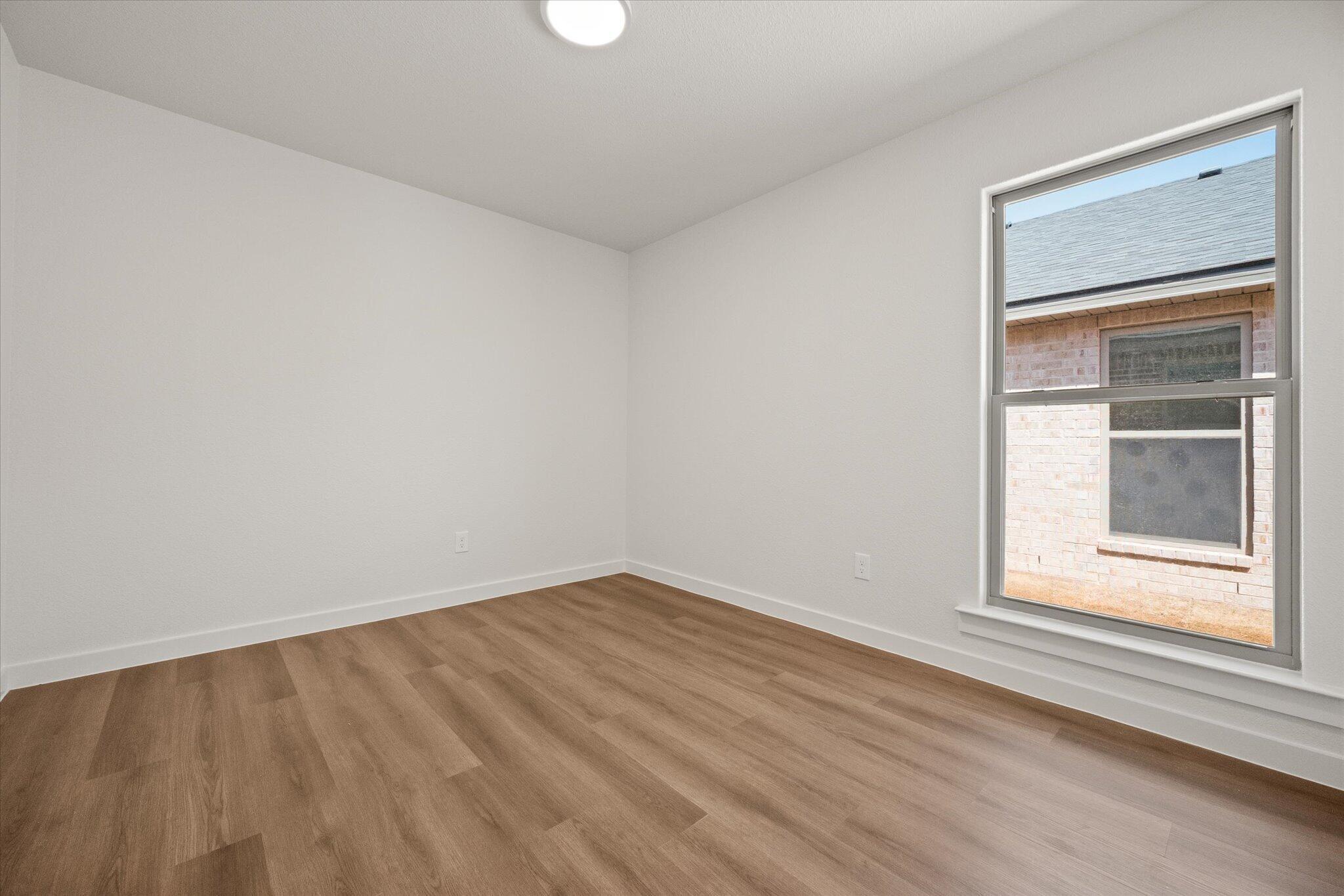 7111 14th Street Lubbock, TX 79416 - Photo 22 of 25 an empty room with a window