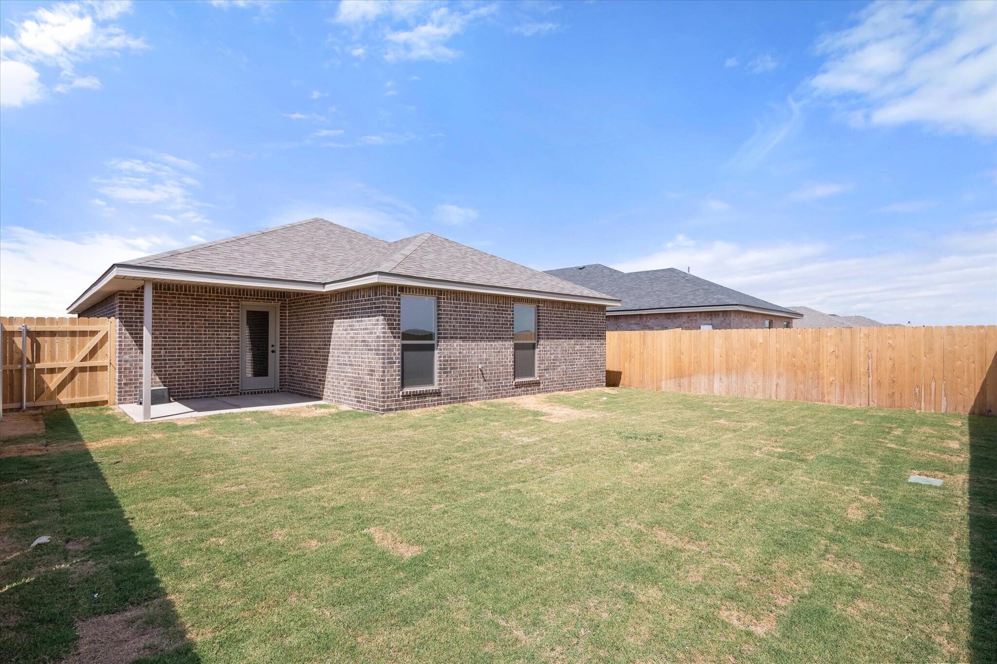 7111 14th Street Lubbock, TX 79416 - Photo 25 of 25 a front view of a house with a yard