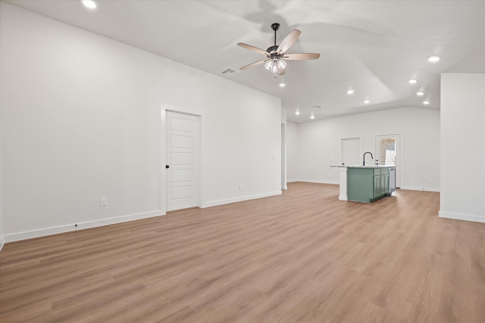 7111 14th Street Lubbock, TX 79416 - Photo 5 of 25 a view of empty room with wooden floor
