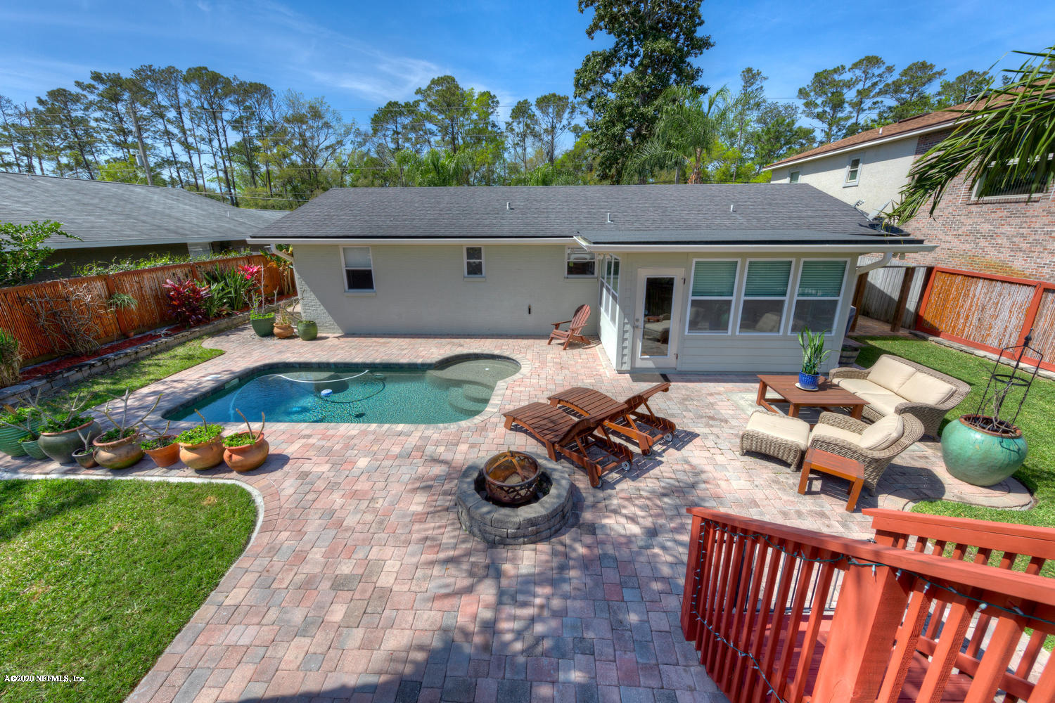 4111 San Pablo Road South Jacksonville, FL 32250 - Photo 3 of 46 a view of house with backyard outdoor seating and green space