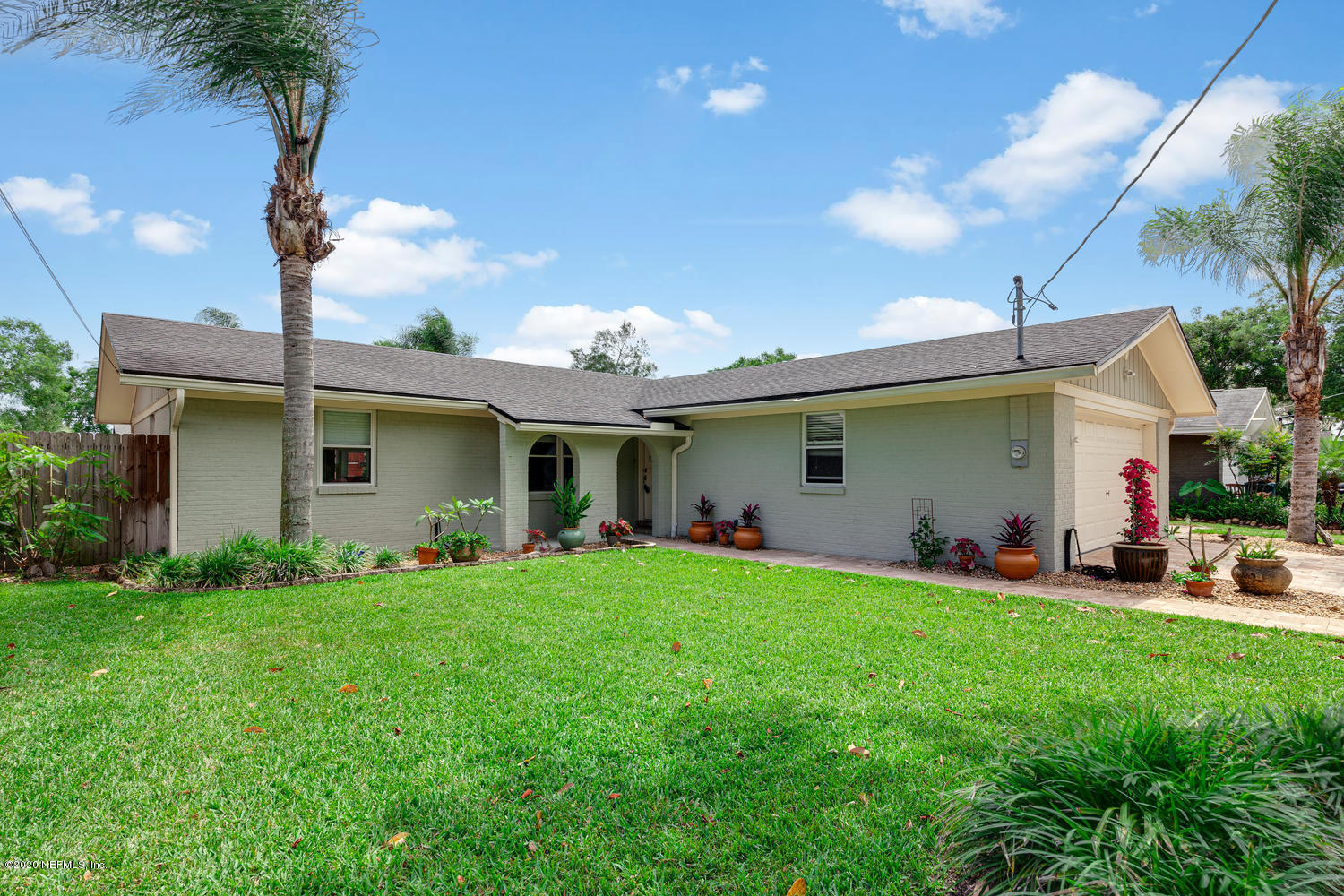 4111 San Pablo Road South Jacksonville, FL 32250 - Photo 46 of 46 a front view of a house with a garden and plants