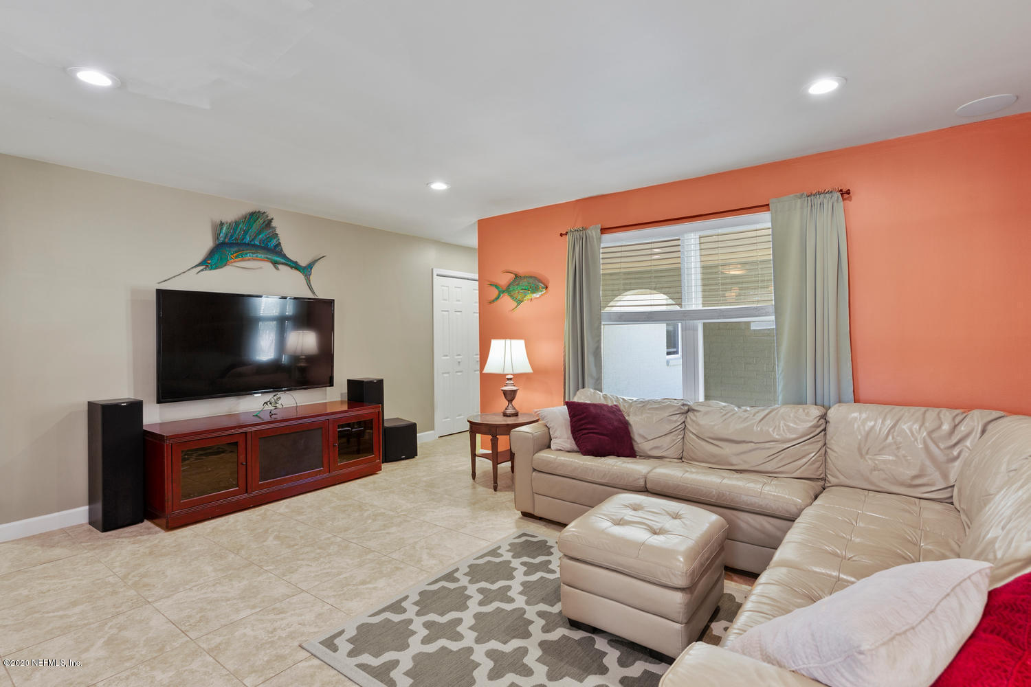 4111 San Pablo Road South Jacksonville, FL 32250 - Photo 7 of 46 a living room with furniture and a flat screen tv