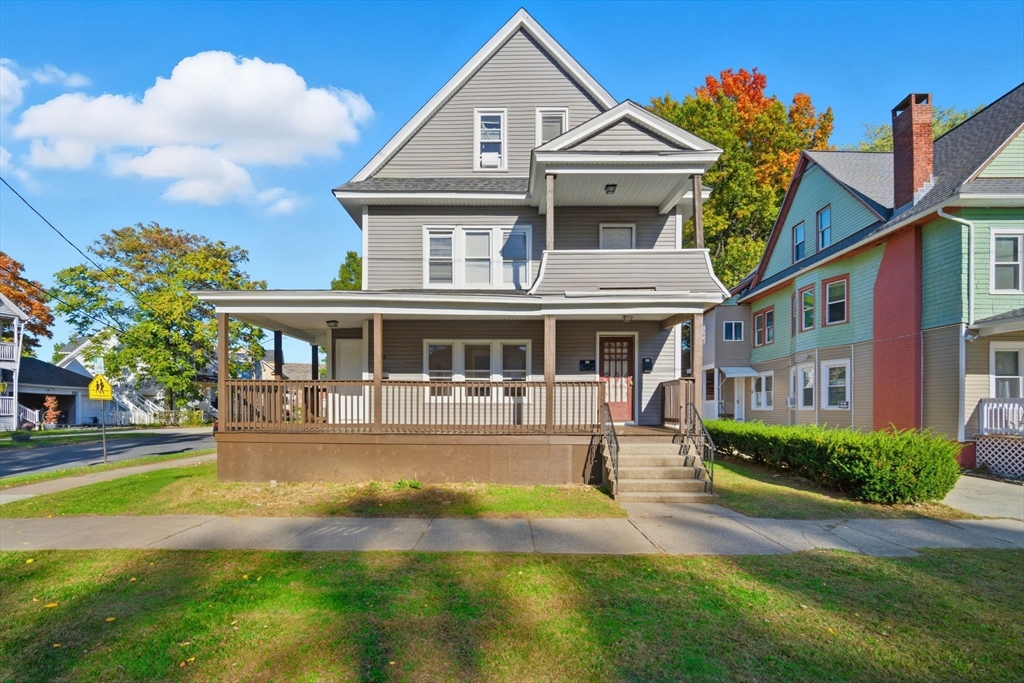35-37 Whittier Street Springfield, MA 01108 - Photo 24 of 24 a front view of a house with a yard table and chairs