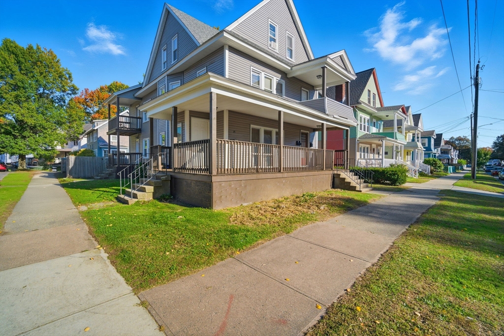 35-37 Whittier Street Springfield, MA 01108 - Photo 3 of 24 a front view of a house with a yard
