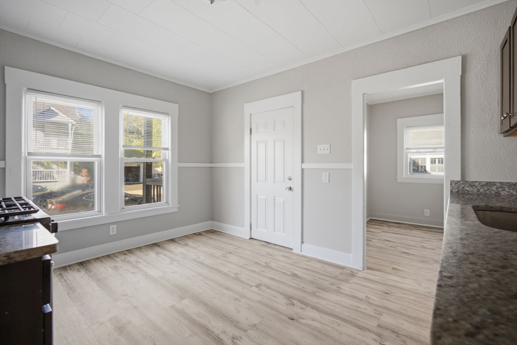 35-37 Whittier Street Springfield, MA 01108 - Photo 9 of 24 wooden floor in an empty room with a window