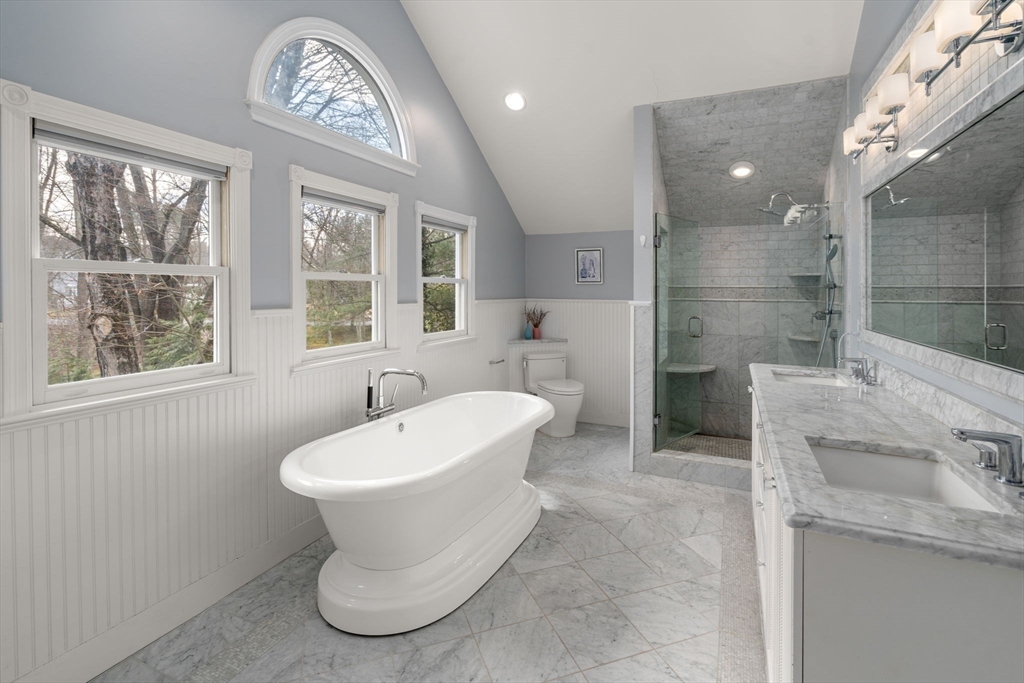3 Parsons Way Natick, MA 01760 - Photo 20 of 32 a bathroom with a sink and a mirror