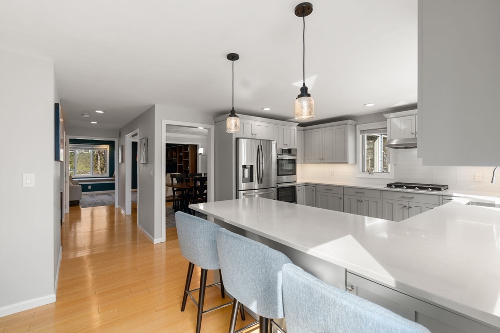 3 Parsons Way Natick, MA 01760 - Photo 2 of 32 a large kitchen with a table and chairs