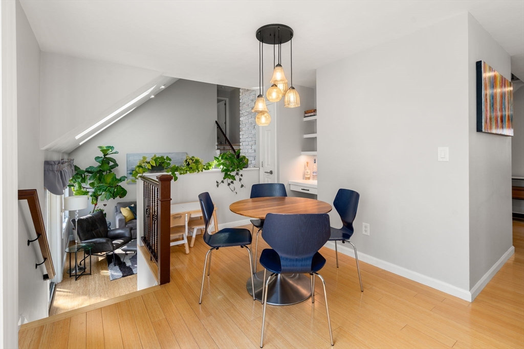 3 Parsons Way Natick, MA 01760 - Photo 7 of 32 a view of a dining room with furniture and a potted plant