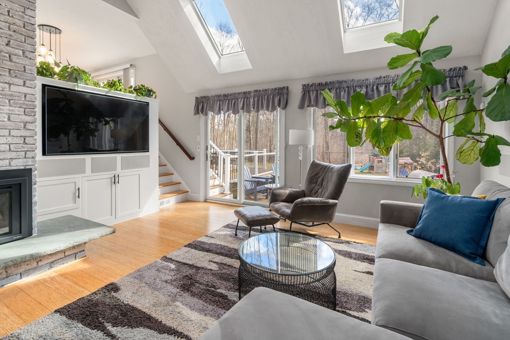 3 Parsons Way Natick, MA 01760 - Photo 8 of 32 a living room with furniture and a flat screen tv