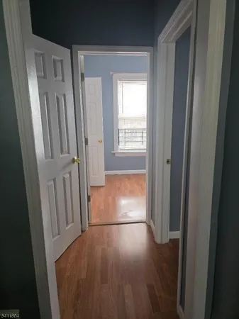 a view of front door with wooden floor