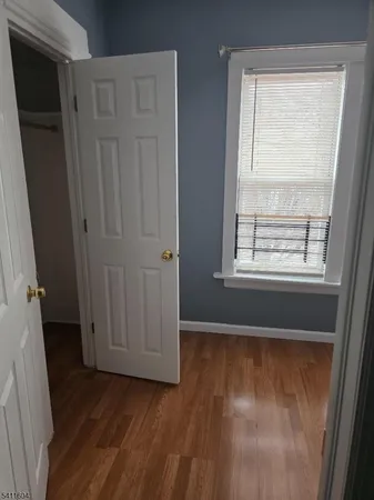 a view of front door with wooden floor