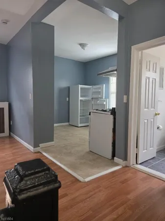 a kitchen with a refrigerator and a stove