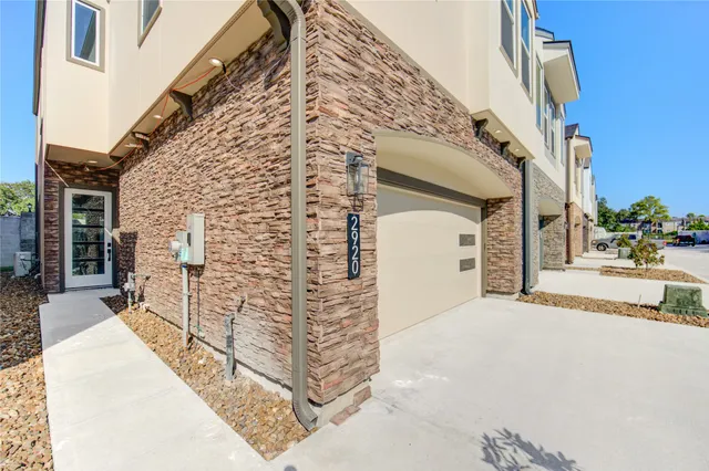 a view of a brick house with many windows