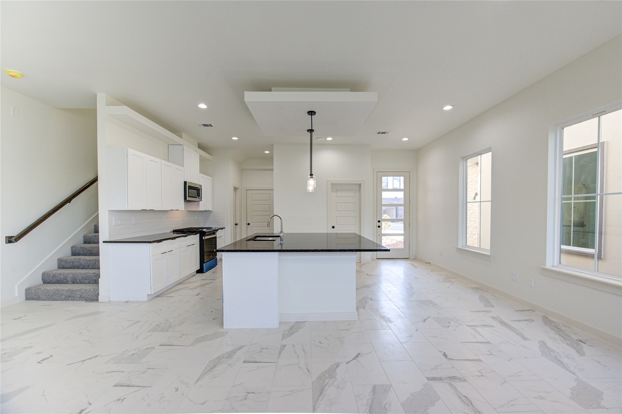 2920 El Fenice Lane Houston, TX 77057 - Photo 6 of 42 a large kitchen with kitchen island granite countertop lots of counter top space