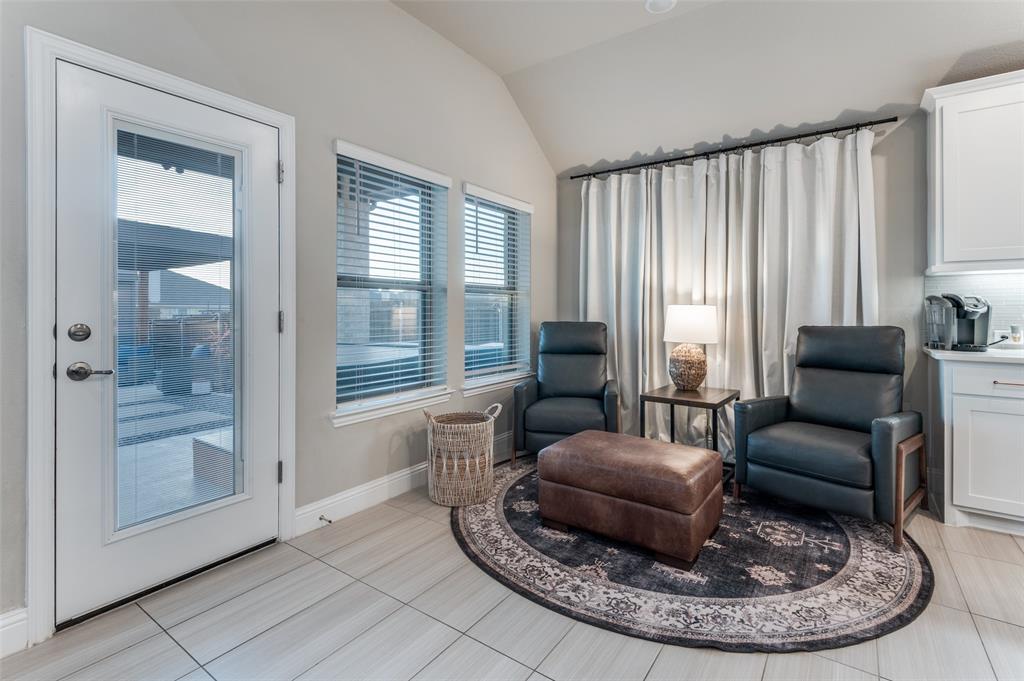 425 Acadia Lane Forney, TX 75126 - Photo 11 of 37 a living room with furniture and a large mirror next to a window