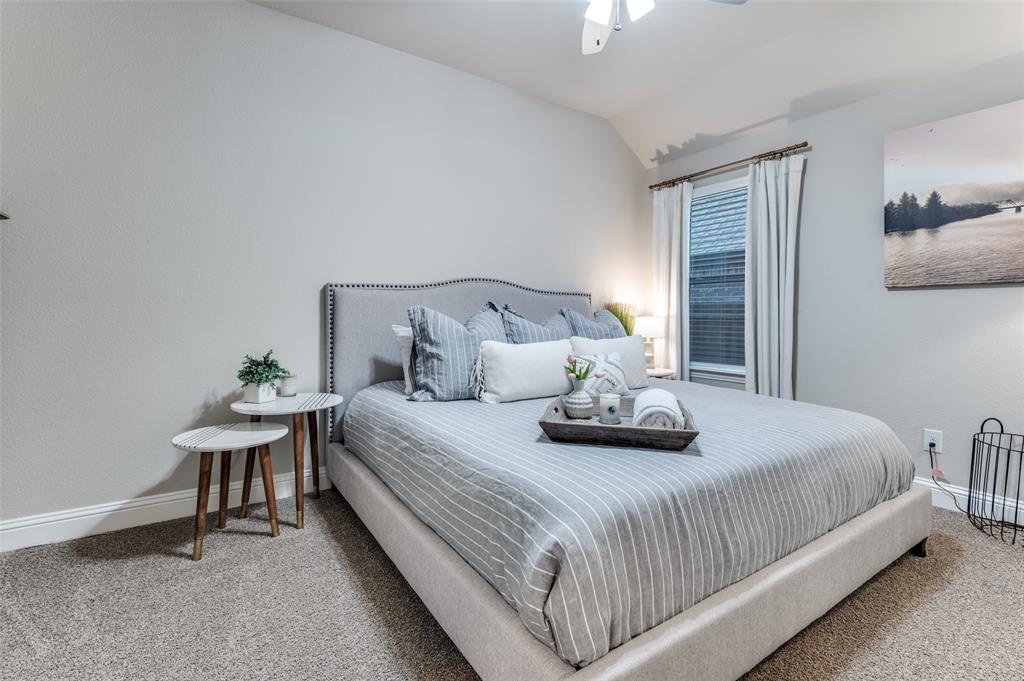 425 Acadia Lane Forney, TX 75126 - Photo 21 of 37 a bedroom with bed and a window