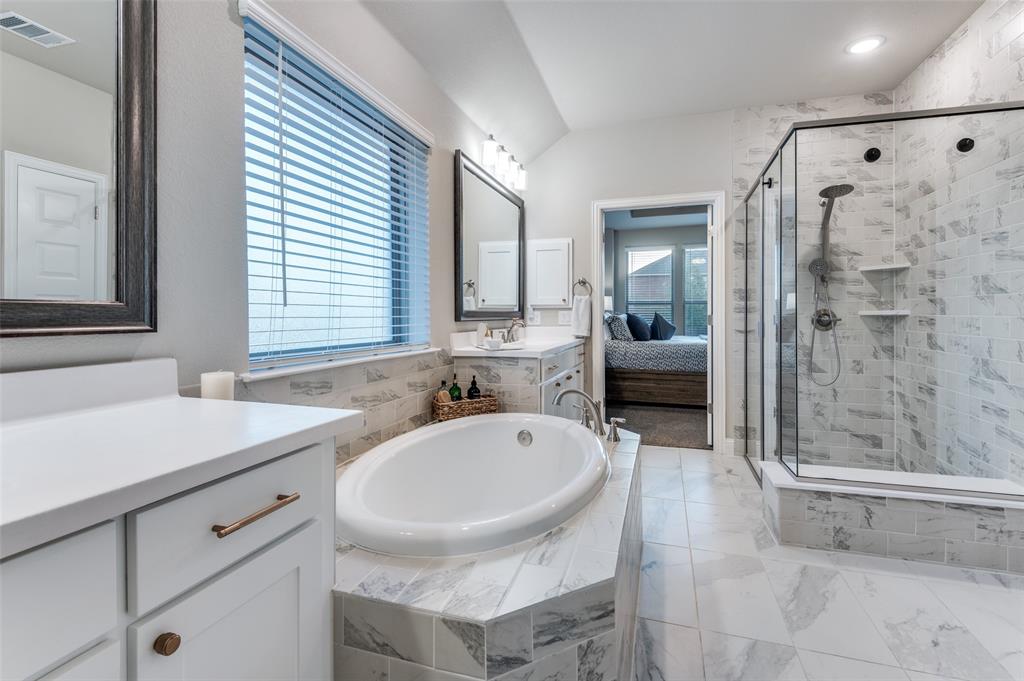 425 Acadia Lane Forney, TX 75126 - Photo 28 of 37 a bathroom with a sink a toilet and shower