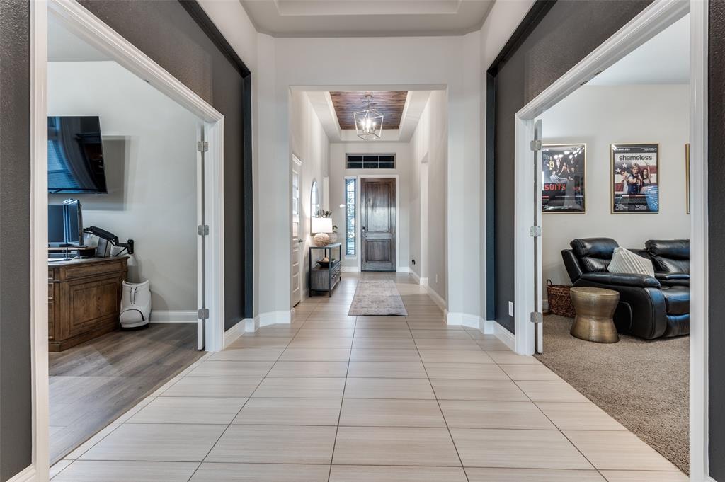 425 Acadia Lane Forney, TX 75126 - Photo 3 of 37 a view of a entryway door and living room