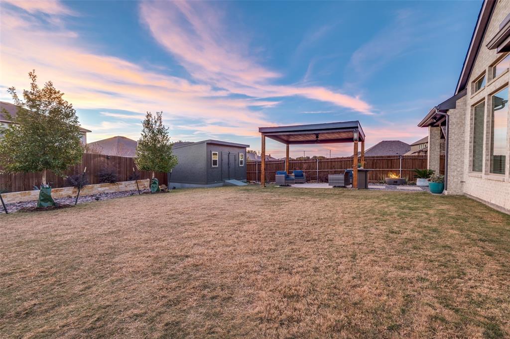 425 Acadia Lane Forney, TX 75126 - Photo 31 of 37 a view of a house with a yard