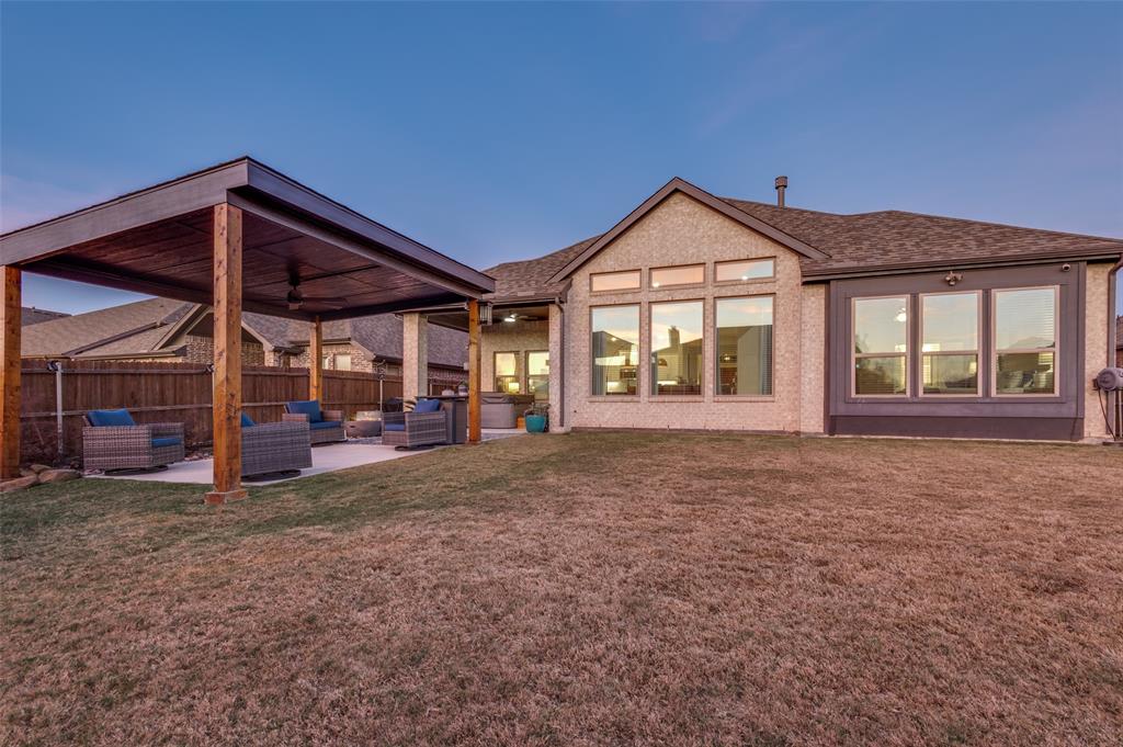 425 Acadia Lane Forney, TX 75126 - Photo 33 of 37 a view of a house with a yard and porch
