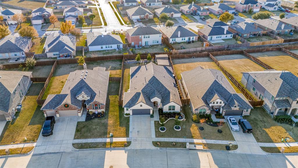 425 Acadia Lane Forney, TX 75126 - Photo 34 of 37 an aerial view of residential houses with outdoor space and parking