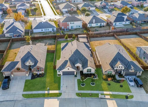 an aerial view of house with yard
