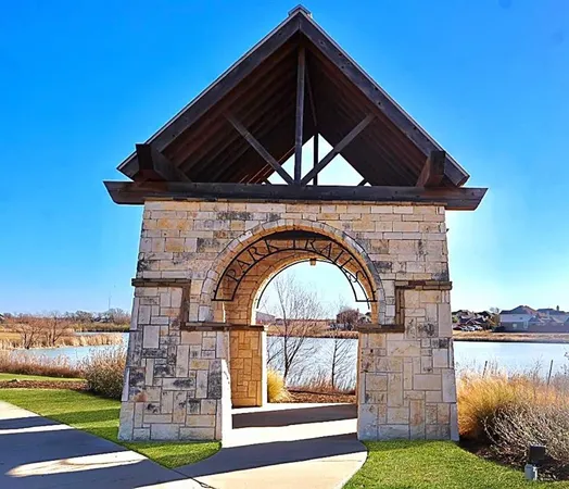 a black and white building with garden view