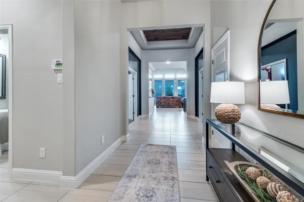 a hallway with a view of living room